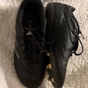 black Adidas Copa Pure II League firm ground soccer cleats.
